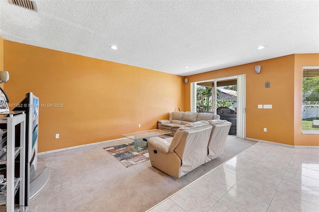 17933 SW 33rd Ct, Miramar, FL 33029 - living room featuring a textured ceiling, healthy amount of natural light, recessed lighting, and light tile patterned floors