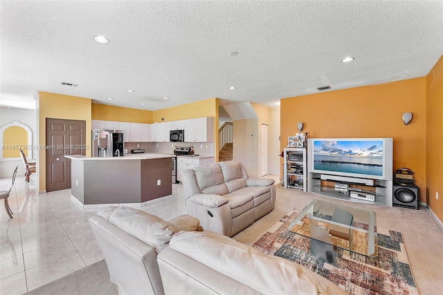 17933 SW 33rd Ct, Miramar, FL 33029 - living area with a textured ceiling, stairs, recessed lighting, baseboards, and light tile patterned flooring