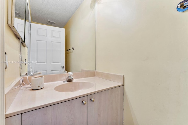 17933 SW 33rd Ct, Miramar, FL 33029 - bathroom featuring a textured ceiling and vanity