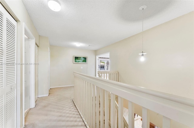 17933 SW 33rd Ct, Miramar, FL 33029 - hall featuring light colored carpet, baseboards, an upstairs landing, and a textured ceiling
