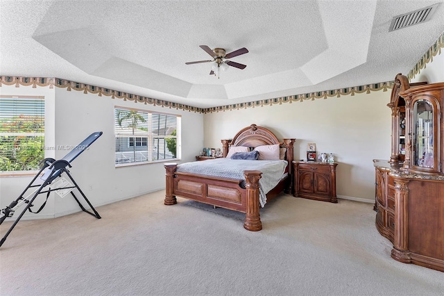17933 SW 33rd Ct, Miramar, FL 33029 - bedroom featuring a textured ceiling, light carpet, a raised ceiling, a ceiling fan, and baseboards