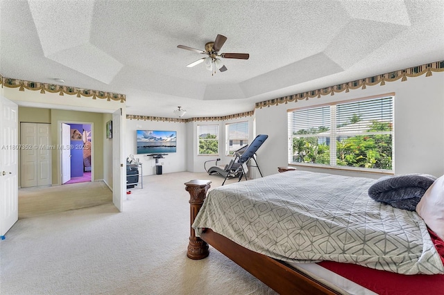 17933 SW 33rd Ct, Miramar, FL 33029 - bedroom featuring a textured ceiling, carpet flooring, a ceiling fan, and a tray ceiling