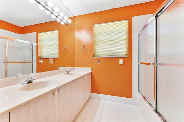 17933 SW 33rd Ct, Miramar, FL 33029 - full bathroom with tile patterned floors, baseboards, double vanity, and bath / shower combo with glass door