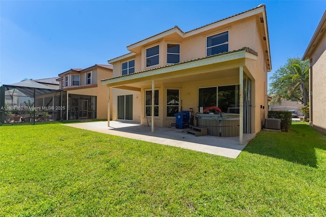 17933 SW 33rd Ct, Miramar, FL 33029 - back of property with stucco siding, a hot tub, a patio area, and central AC unit