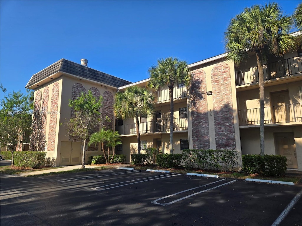 3361 NW 85th Ave Unit 305, Coral Springs, FL 33065 - view of property featuring uncovered parking