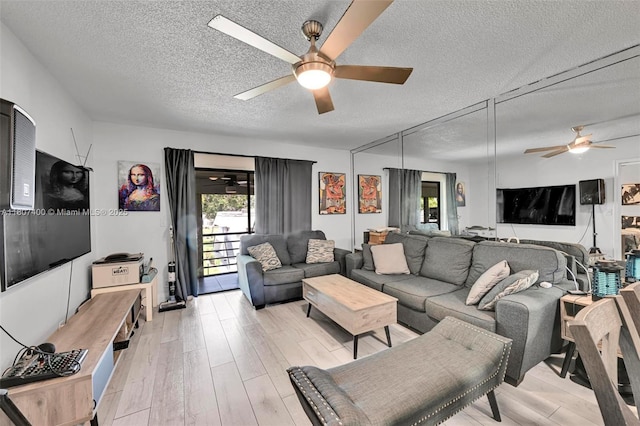 3361 NW 85th Ave Unit 305, Coral Springs, FL 33065 - living room with ceiling fan, a textured ceiling, and light wood-style flooring