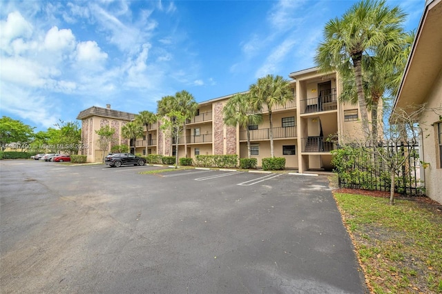 3361 NW 85th Ave Unit 305, Coral Springs, FL 33065 - view of property with uncovered parking and a residential view
