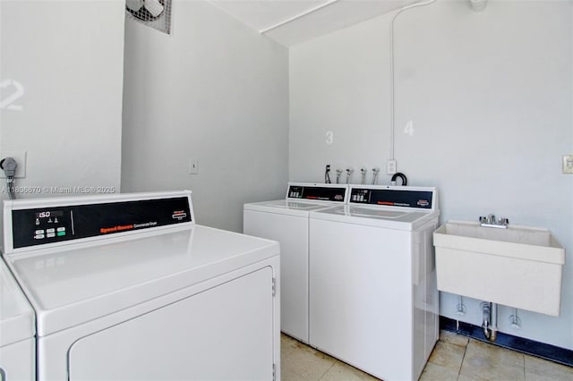 1965 S Ocean Dr Unit Mq, Hallandale Beach, FL 33009 - shared laundry room with washer and clothes dryer and light tile patterned floors