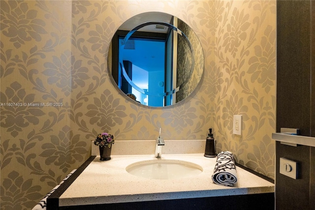 18201 Collins Ave Unit 3909, Sunny Isles Beach, FL 33160 - bathroom featuring wallpapered walls and vanity