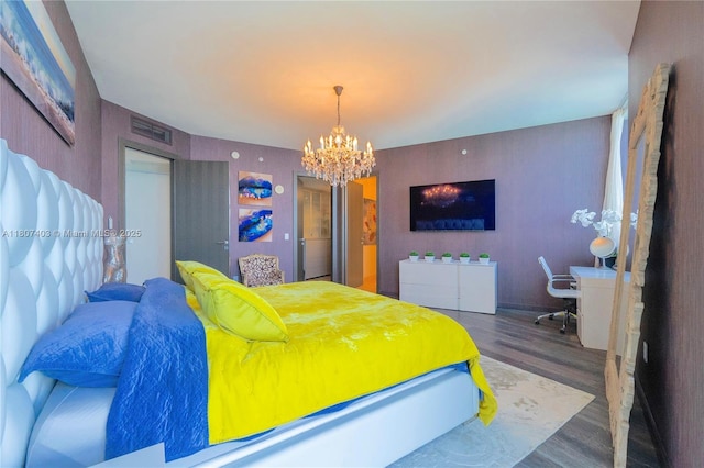 18201 Collins Ave Unit 3909, Sunny Isles Beach, FL 33160 - bedroom featuring wood finished floors and a chandelier