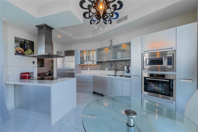 18201 Collins Ave Unit 3909, Sunny Isles Beach, FL 33160 - kitchen featuring built in appliances, ventilation hood, and modern cabinets