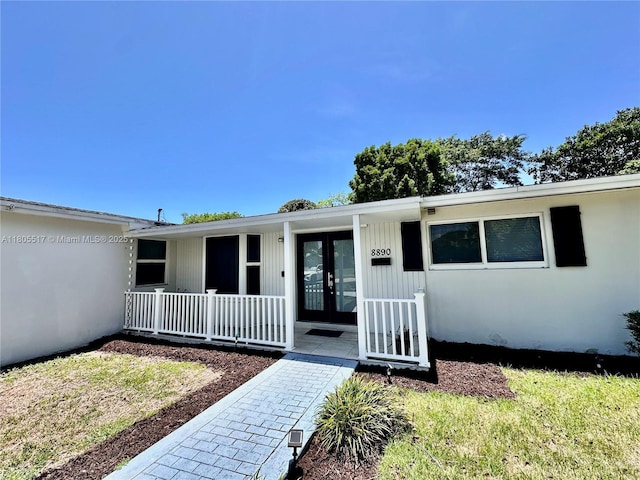8890 SW 155th Ter, Palmetto Bay, FL 33157 - property entrance with covered porch and french doors