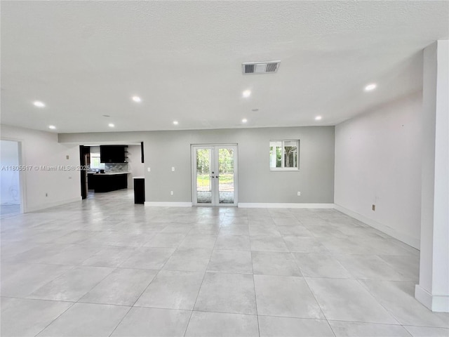 8890 SW 155th Ter, Palmetto Bay, FL 33157 - unfurnished living room featuring recessed lighting, french doors, light tile patterned flooring, and baseboards