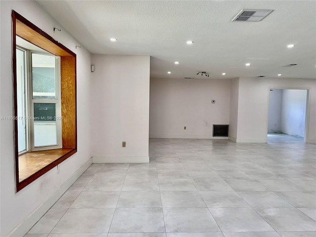 8890 SW 155th Ter, Palmetto Bay, FL 33157 - spare room featuring recessed lighting, a textured ceiling, light tile patterned flooring, and baseboards