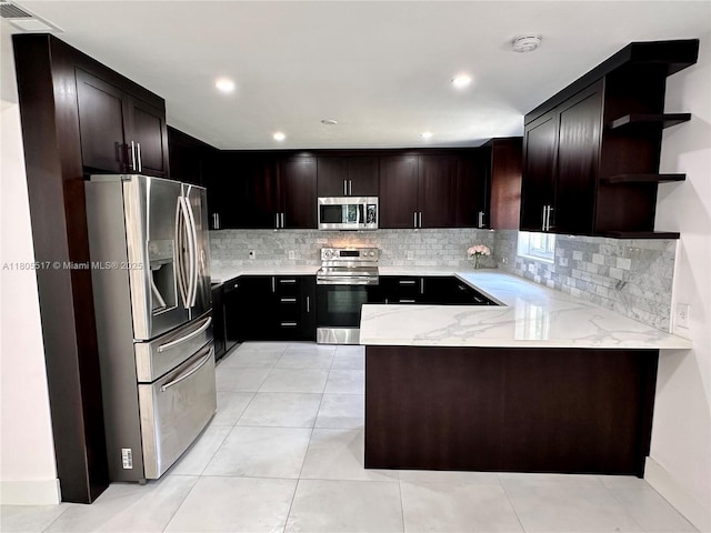 8890 SW 155th Ter, Palmetto Bay, FL 33157 - kitchen featuring appliances with stainless steel finishes, open shelves, a peninsula, tasteful backsplash, and light stone counters