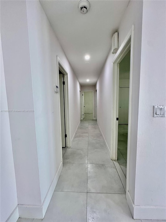 8890 SW 155th Ter, Palmetto Bay, FL 33157 - corridor featuring baseboards and concrete flooring