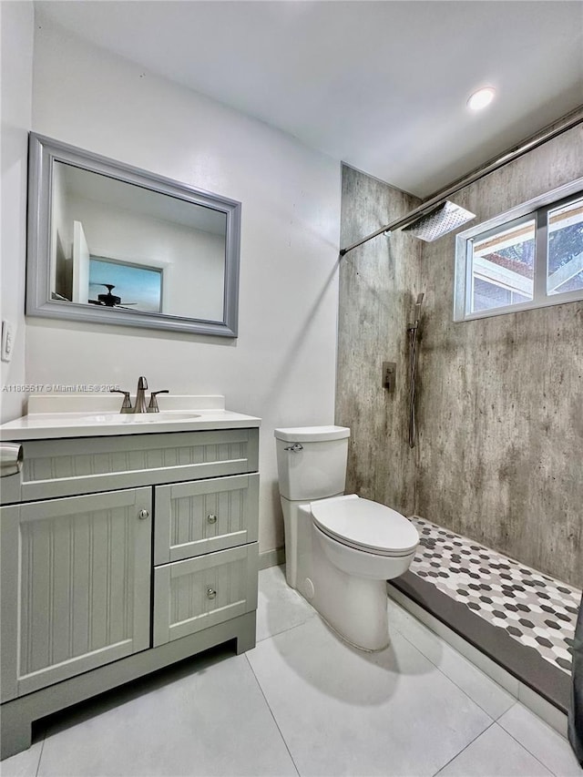 8890 SW 155th Ter, Palmetto Bay, FL 33157 - full bathroom with toilet, tiled shower, vanity, and tile patterned floors