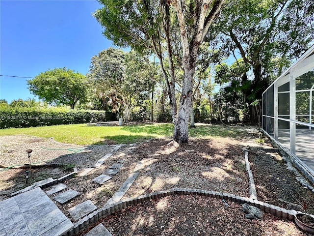 8890 SW 155th Ter, Palmetto Bay, FL 33157 - view of green lawn featuring a lanai