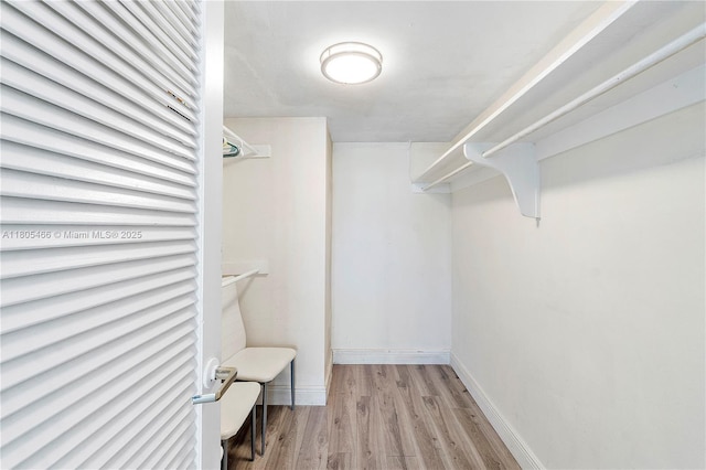 900 Bay Dr Unit 210, Miami Beach, FL 33141 - spacious closet featuring wood finished floors