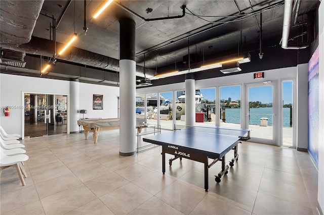 900 Bay Dr Unit 210, Miami Beach, FL 33141 - rec room with pool table, a towering ceiling, a water view, and tile patterned flooring