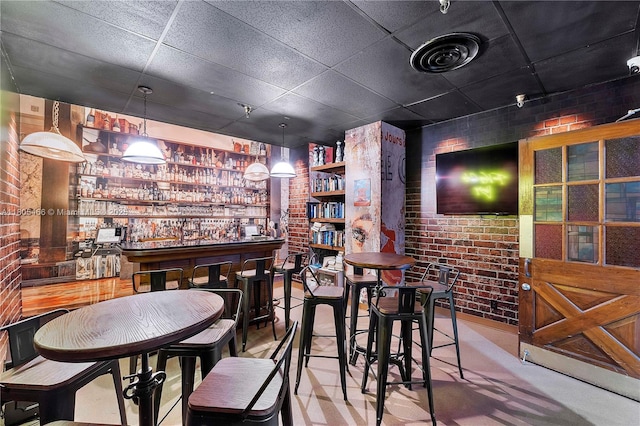 900 Bay Dr Unit 210, Miami Beach, FL 33141 - indoor dry bar featuring brick wall and a paneled ceiling