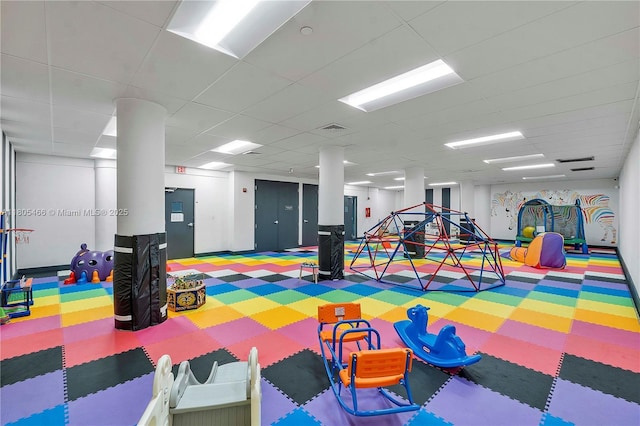 900 Bay Dr Unit 210, Miami Beach, FL 33141 - recreation room featuring tile patterned floors and a paneled ceiling