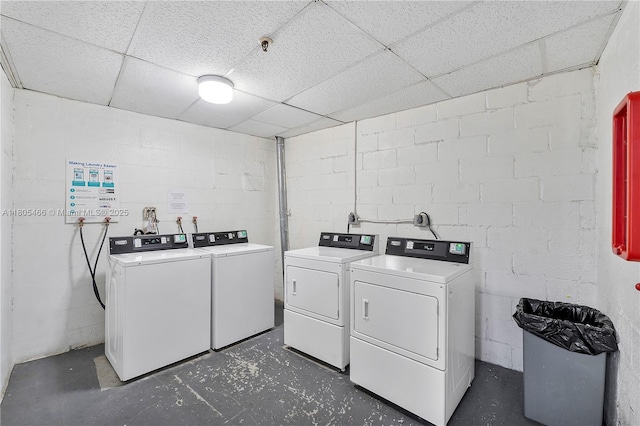 900 Bay Dr Unit 210, Miami Beach, FL 33141 - shared laundry featuring washer and clothes dryer and concrete block wall