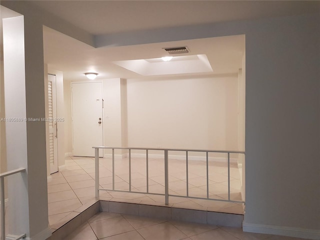 3730 Inverrary Dr Unit 2N, Lauderhill, FL 33319 - hall featuring a tray ceiling and tile patterned flooring