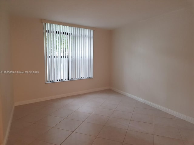 3730 Inverrary Dr Unit 2N, Lauderhill, FL 33319 - spare room featuring light tile patterned floors and baseboards