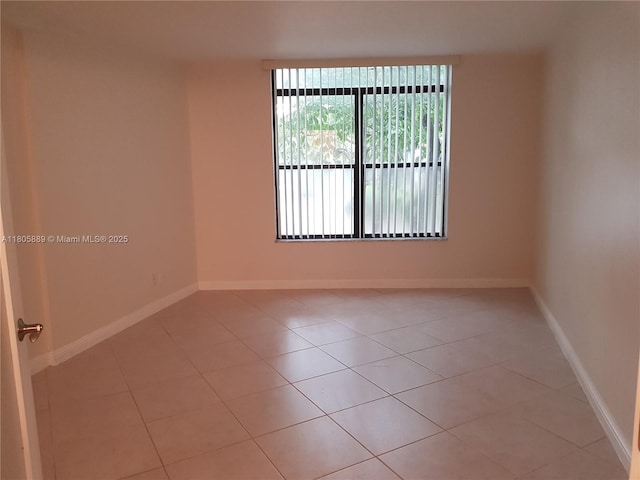3730 Inverrary Dr Unit 2N, Lauderhill, FL 33319 - empty room with light tile patterned flooring and baseboards