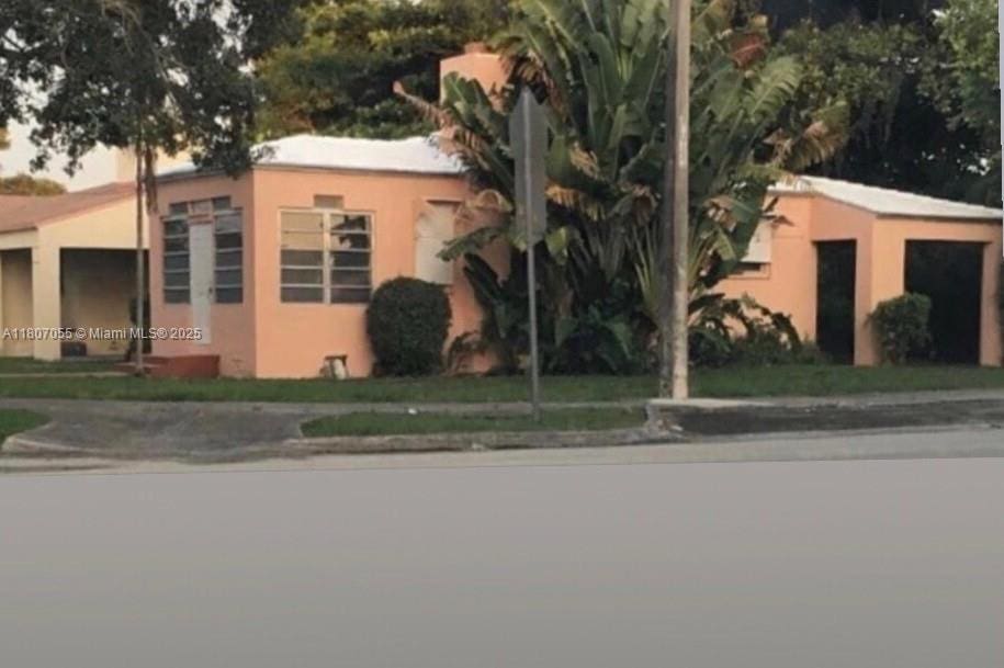 1390 NW 56th St, Miami, FL 33142 - view of front of property with stucco siding