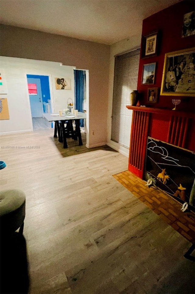 1390 NW 56th St, Miami, FL 33142 - living area featuring wood finished floors and baseboards