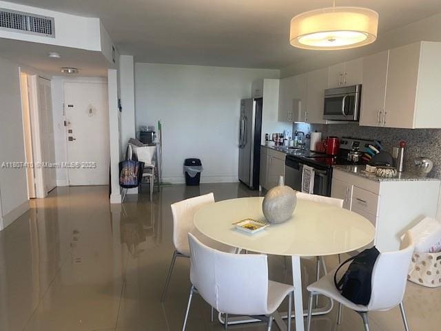 2801 NE 183rd St Unit 1011W, Aventura, FL 33160 - dining space with baseboards