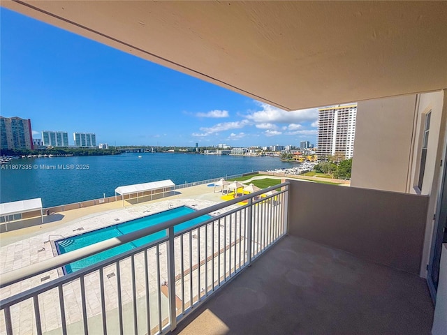 250 174th St Unit 601, Sunny Isles Beach, FL 33160 - balcony featuring a water view, view of pool, and a city view