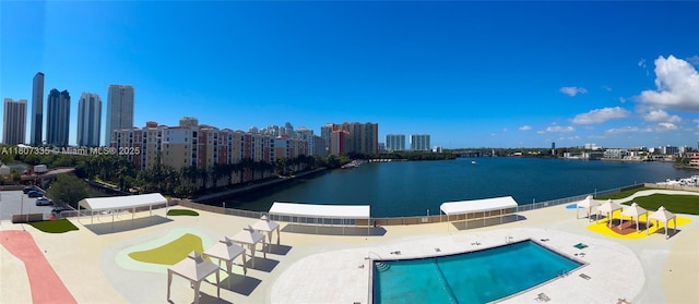 250 174th St Unit 601, Sunny Isles Beach, FL 33160 - community pool with a view of skyline, a water view, and a patio