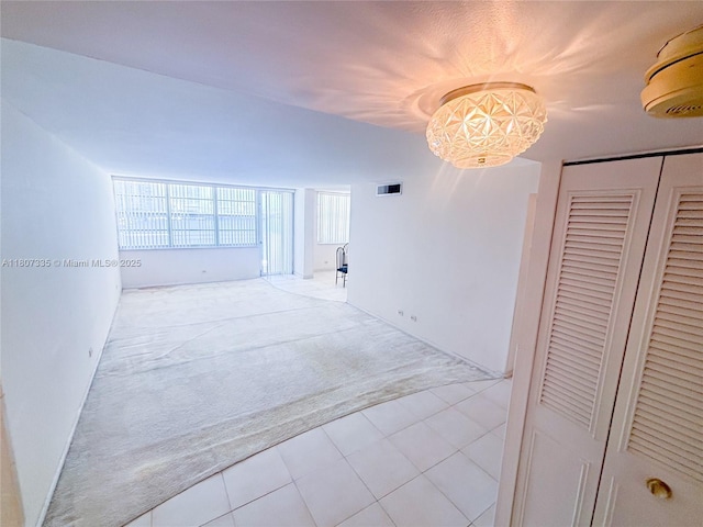 250 174th St Unit 601, Sunny Isles Beach, FL 33160 - corridor featuring carpet, tile patterned floors, and a chandelier