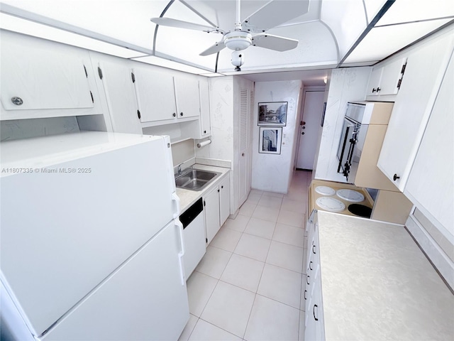 250 174th St Unit 601, Sunny Isles Beach, FL 33160 - kitchen with freestanding refrigerator, light countertops, ceiling fan, light tile patterned floors, and a sink