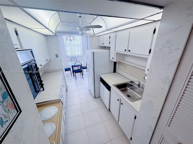 250 174th St Unit 601, Sunny Isles Beach, FL 33160 - kitchen with a sink, white appliances, ceiling fan, light tile patterned floors, and light countertops