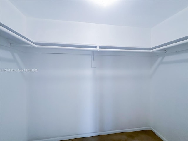 250 174th St Unit 601, Sunny Isles Beach, FL 33160 - spacious closet featuring dark colored carpet