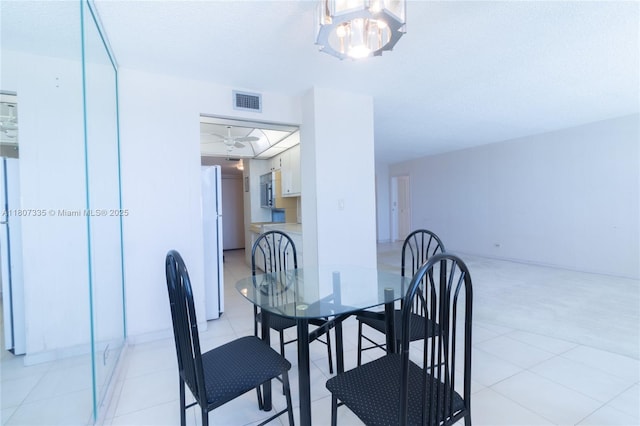 250 174th St Unit 601, Sunny Isles Beach, FL 33160 - dining area with light tile patterned floors and a chandelier