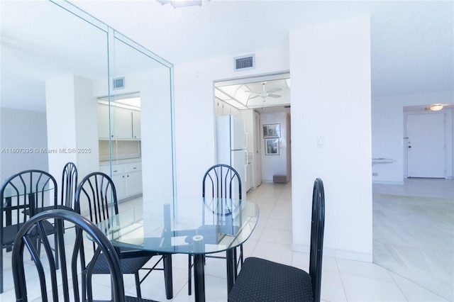 250 174th St Unit 601, Sunny Isles Beach, FL 33160 - dining space with light colored carpet, ceiling fan, baseboards, and light tile patterned flooring