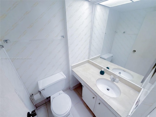 250 174th St Unit 601, Sunny Isles Beach, FL 33160 - bathroom featuring toilet, vanity, and tile patterned floors