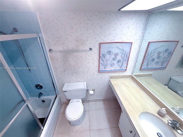 250 174th St Unit 601, Sunny Isles Beach, FL 33160 - full bathroom with toilet, shower / bath combination with glass door, vanity, tile patterned floors, and wallpapered walls