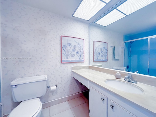 250 174th St Unit 601, Sunny Isles Beach, FL 33160 - bathroom featuring toilet, wallpapered walls, vanity, tile patterned floors, and a shower with door
