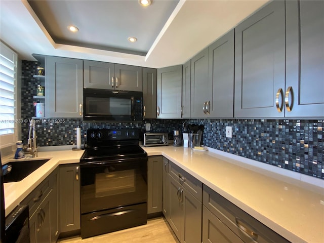 535 Hendricks Isle Unit 303, Fort Lauderdale, FL 33301 - kitchen featuring black appliances, light countertops, open shelves, tasteful backsplash, and recessed lighting