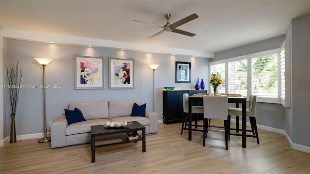 535 Hendricks Isle Unit 303, Fort Lauderdale, FL 33301 - living room with ceiling fan, light wood finished floors, and baseboards