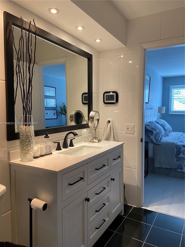 535 Hendricks Isle Unit 303, Fort Lauderdale, FL 33301 - ensuite bathroom with vanity and tile patterned flooring