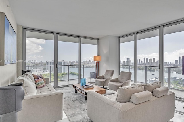 16385 Biscayne Blvd Unit 2707, North Miami Beach, FL 33160 - living area with floor to ceiling windows, a view of skyline, and a water view