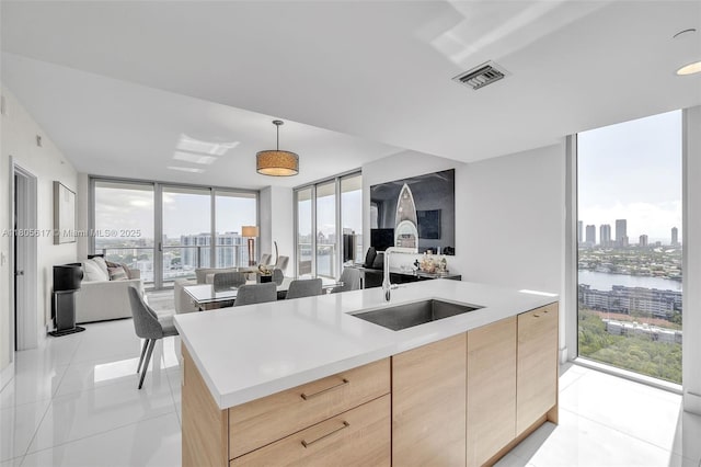 16385 Biscayne Blvd Unit 2707, North Miami Beach, FL 33160 - kitchen with open floor plan, light brown cabinets, a sink, modern cabinets, and floor to ceiling windows