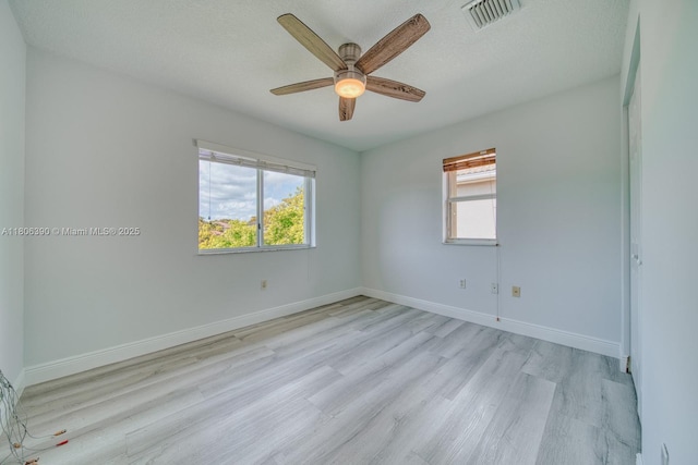 9018 SW 211th Ln, Cutler Bay, FL 33189 - spare room featuring light wood-style flooring, ceiling fan, and baseboards